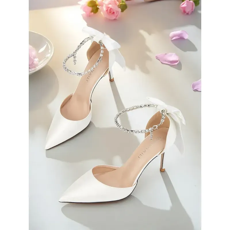 fbkkyv1756782927026.webp Women's Ivory Satin Pointed Toe Stiletto Heels with Bow and Rhinestone Ankle Strap - Elegant Wedding and Formal Occasion Shoes 2025 - Image 1